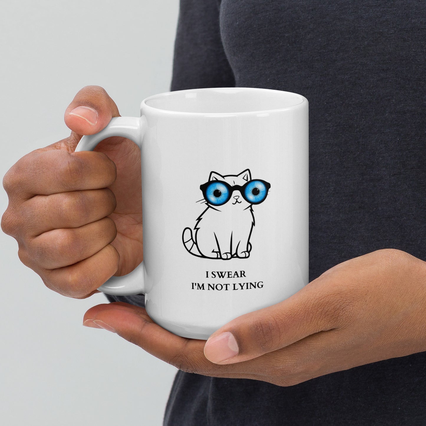 Lying cat with big blue eyes - White glossy mug