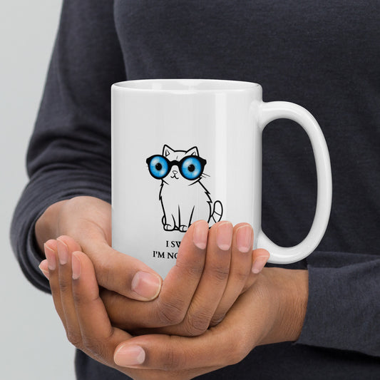 Lying cat with big blue eyes - White glossy mug